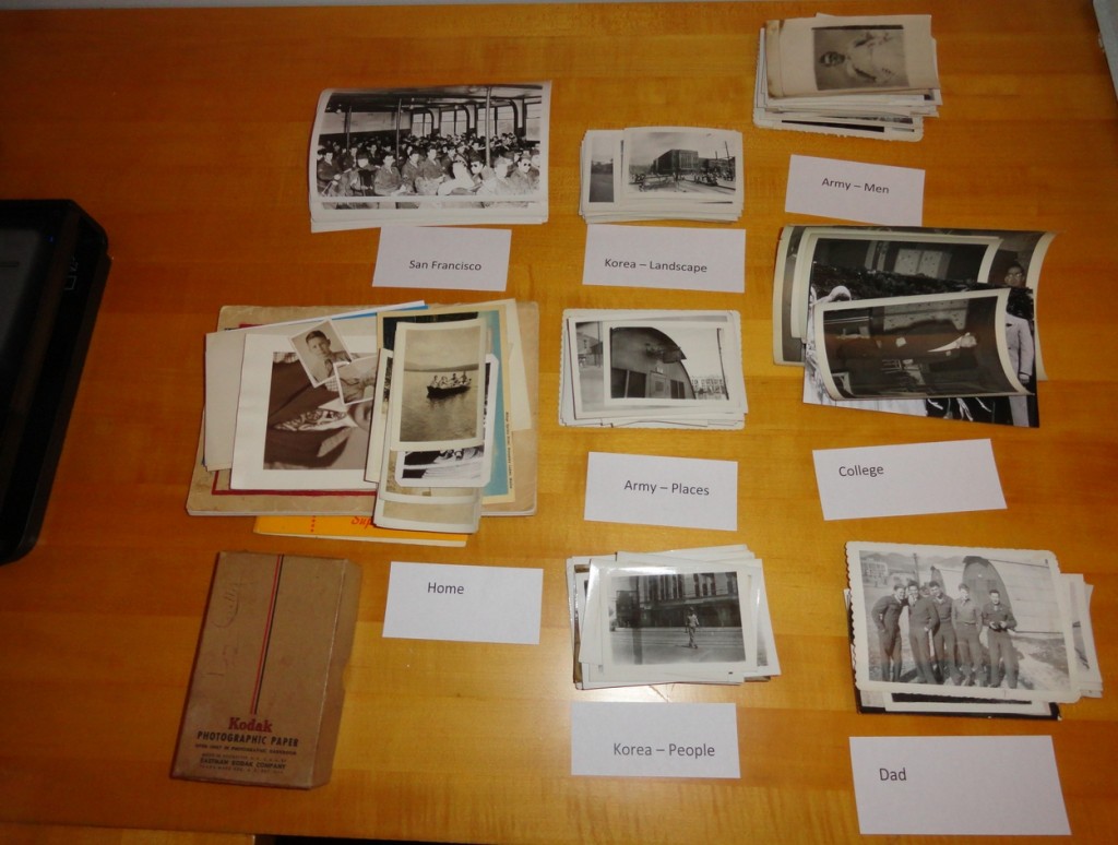 All of the photographs from the box have been separated into pile by place and category. These labels will match the file names on my computer where the scans will be stored.
